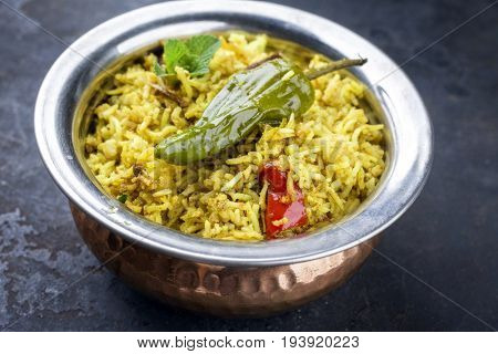 Indian Vegetable Biryani with Sweet Peppers as close-up in a frying pan