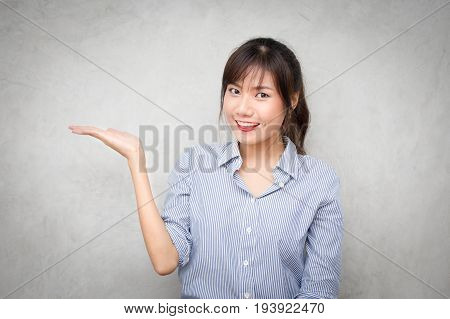 Young Asian Women Showhand For Present Something With Happy Emotion.