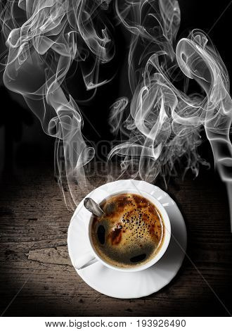 a cup of coffee on old wooden table - breakfast