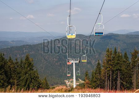 Mountain lift. Ropeway construction. Cabin moving on cableway, nature background