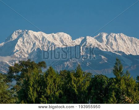 POKHARA, NEPAL. Shooting from a bird's eye view from a deltaplan. The Himalayas, North of Annapurna on the background of blue sky.