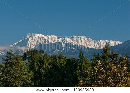 POKHARA, NEPAL. Shooting from a bird's eye view from a deltaplan. The Himalayas, North of Annapurna on the background of blue sky.