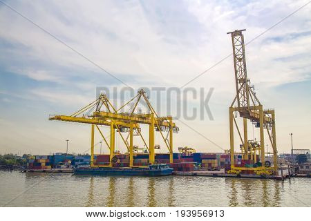 Logistic concept Small container ship Vice containers are loaded on ships. In order to send a large ship. The waiting area point mooring buoy lights mouth.