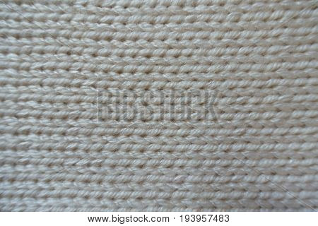 Close Up Of Handmade Ivory Stockinet Textile From Above