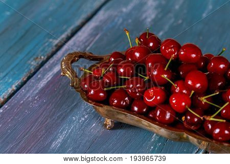 Detail Of Ripe Red Cherries On A Wooden Board. Harvested Sweet Cherries.