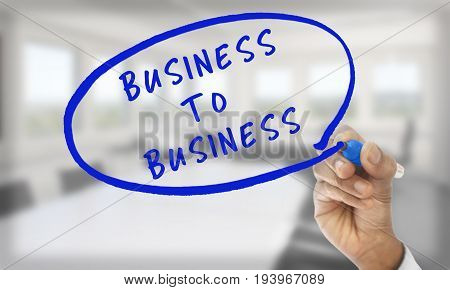 Hand writing business to business with blue pencil
