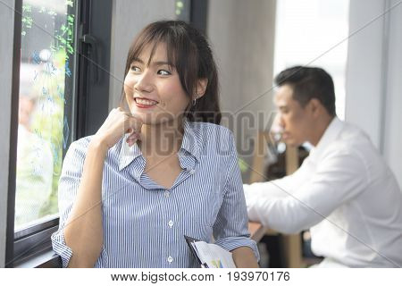 Asian Young Woman With Happy Emotion At Working Place 20-30 Year Old.