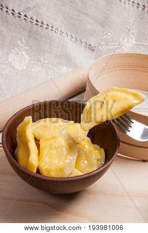 Close Up View Of Boiled Varenyky Or Dumpling With Cottage Cheese Or Curd On Metal Fork. Fresh Boiled
