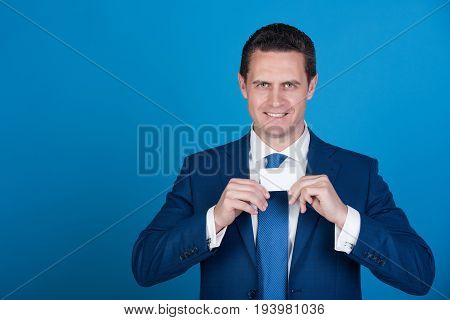 Manager Smiling With Bank Or Business Card