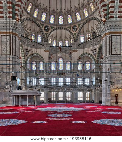 Istanbul, Turkey - April 25, 2017: Fatih Mosque a public Ottoman mosque in the Fatih district of Istanbul Turkey with a huge decorated domes & many colored stained glass windows