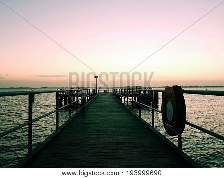 Long Touristic Mole Within Autumn Misty Morning. Wet And Slippery Wooden Floor,