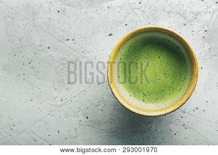 Top View Of Green Tea Matcha In A Bowl On Concrete Surface