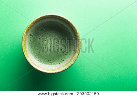 Top View Of Tea Matcha In A Bowl On Greeen Surface