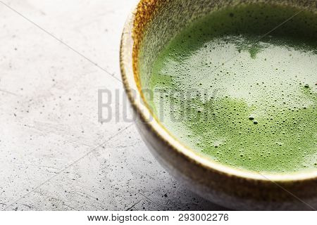 Top View Of Green Tea Matcha In A Bowl On Concrete Surface. Close Up Shot