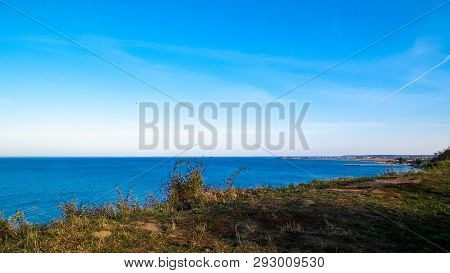 Baltic Sea From Cliff In Mechelinki, Poland. Nature And Travel Concept. Copy Space On Blue Sky.