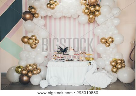 Delicious Sweet Buffet With Cake. White Swan Candy Bar. Design Of Balloons. Many White And Golden Ba
