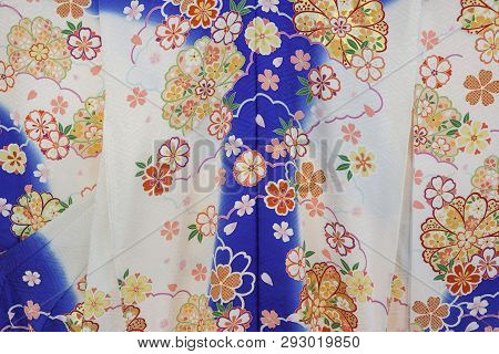Japanese Traditional Clothes Of Kimono, Yukata, With Blue And White Colors And Flowers Motive