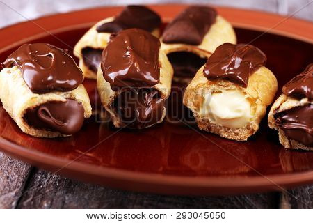 Traditional French Dessert. Eclair With Chocolate Icing. Pastery Concept With Chocolate Eclair