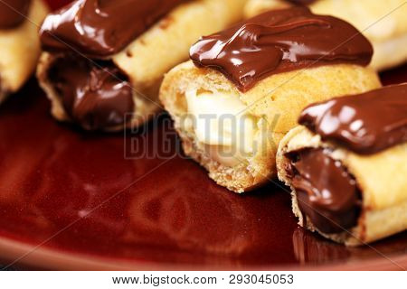 Traditional French Dessert. Eclair With Chocolate Icing. Pastery Concept With Chocolate Eclair