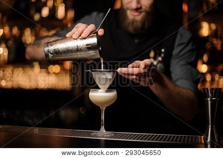 Bartender Pours Cocktail Adding Sour Mix In Glass