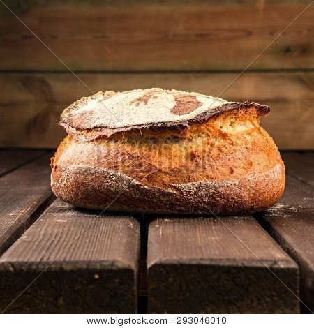 Kamut Round Bread Made With Sourdough On A Wooden Table Board