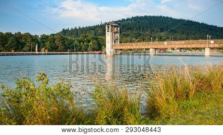 Stara Morawa, Observation Tower By The Lake Among Mountain Peaks.