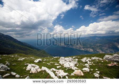 View of the Lake Garda from Monte Baldo, Italy.Panorama of the gorgeous Garda lake surrounded by mountains.
