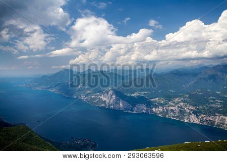 View of the Lake Garda from Monte Baldo, Italy.Panorama of the gorgeous Garda lake surrounded by mountains.
