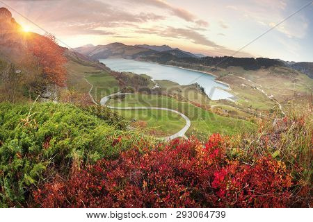Mountains And Lake Roselend  With A Dike