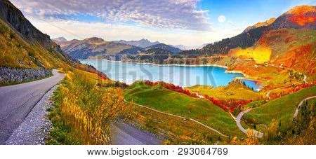 Mountains And Lake Roselend  With A Dike