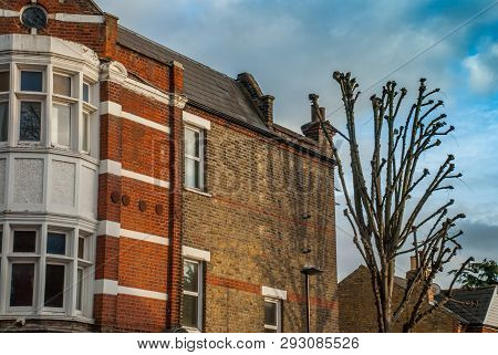 Beautiful Brown Stone Townhouse With Glass Windows In The Chiswick Area Of London.