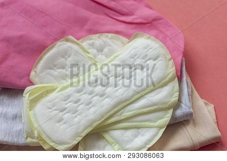Women's Panties And Feminine Hygiene Pad On A Red Background. Menstruation Period