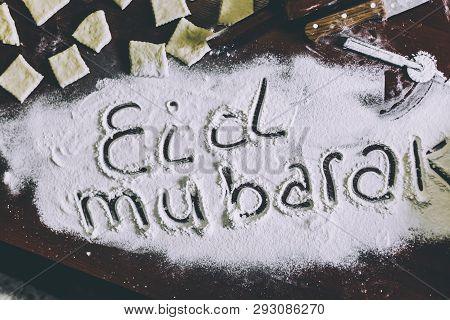 Eid Mubarak Phrase Written On Flour. Preparation Process Of Traditional Arabic Muslim Cooks