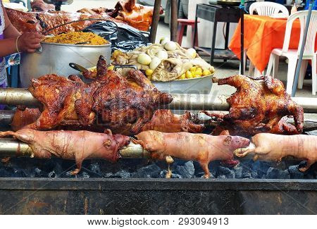 Traditional Delicious Food Of South America - Roasted Guinea Pig Or Cuy, Whole Chickens, Potatoes, P