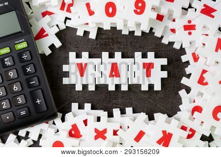Value Added Tax, Vat Concept, White Puzzle Jigsaw With Alphabet Building The Word Vat With Calculato