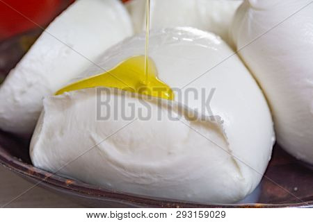 Balls And Pieces Of Buffalo Mozzarella, Soft Italian Scheese Made From The Milk Of Italian Mediterra