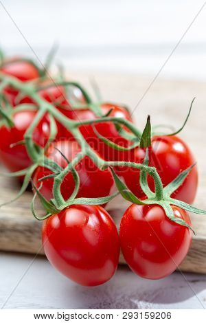 Vine Of Fresh Ripe Red Cherry Prunella Tomates