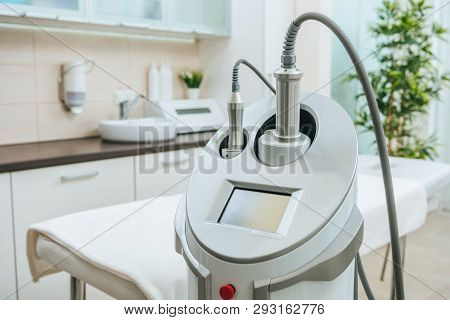 Grey Endospheres Apparatus With Hoses Near Beauty Couch In Clinic