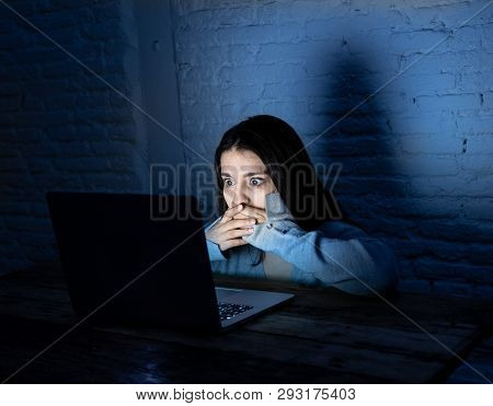 Portrait Of Sad Woman With A Laptop In The Dark Suffering Harassment And Internet Cyberbullying