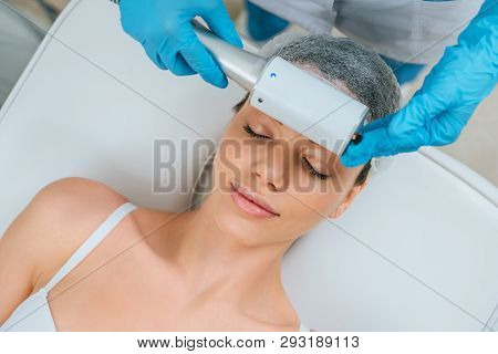 Partial View Of Cosmetologist Doing Endospheres Therapy For Face