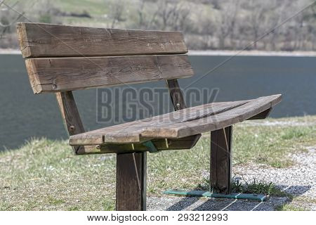 A Relaking Bench On Beach At Lake