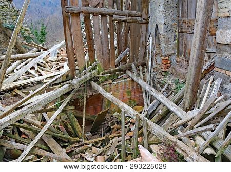 Planks And Rubble And The Ruins Of The House Completely Destroyed By Earthquake