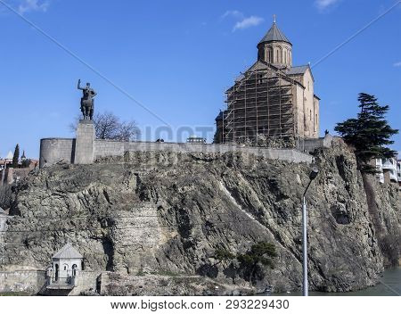 Metekhi Church And The Monument To The Founder Of The City Vakhtang Gorgasali On The Bank Of River M