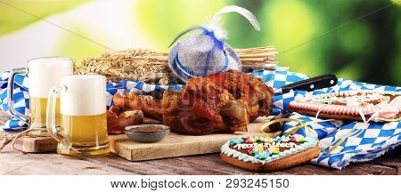 Traditional German Cuisine, Schweinshaxe Roasted Ham Hock. Beer, Pretzels And Various Bavarian Speci