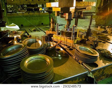 Dirty Used Low Tech Stamping Press Producing Round Aliminium Parts