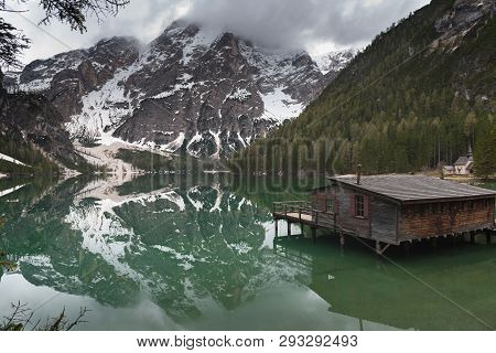 Braies Lake In Dolomites Mountains Forest Trail In Background, Sudtirol, Italy. Lake Braies Is Also 