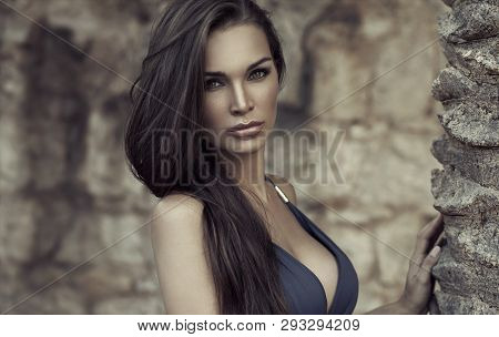 Female Brunette Model Posing Near The Pal
