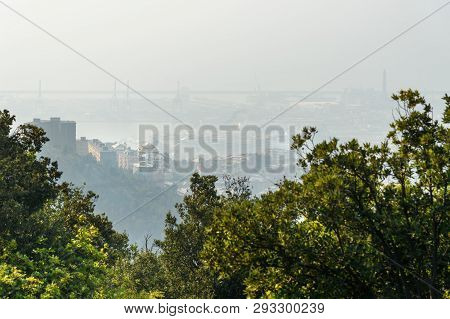 View Of Genoa In The Fog From Mount Peralto. Italy