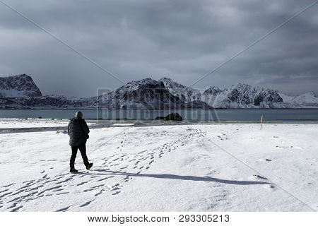 Nature photographer on Haukland Beach in Lofoten Archipelago, Norway, Europe