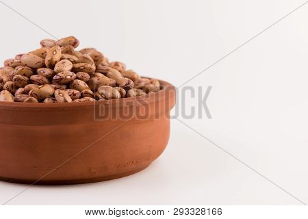 A Plate Of Beans On White Background